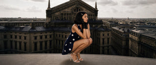 Woman in polka dot mini dress on rooftop skyline