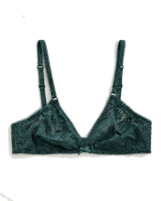 Green lace bra on a white background
